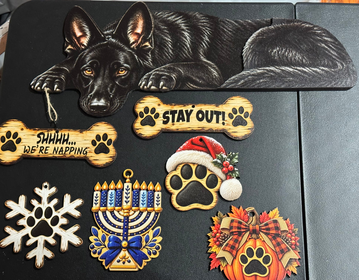 Black Shepherd door topper with various charms
